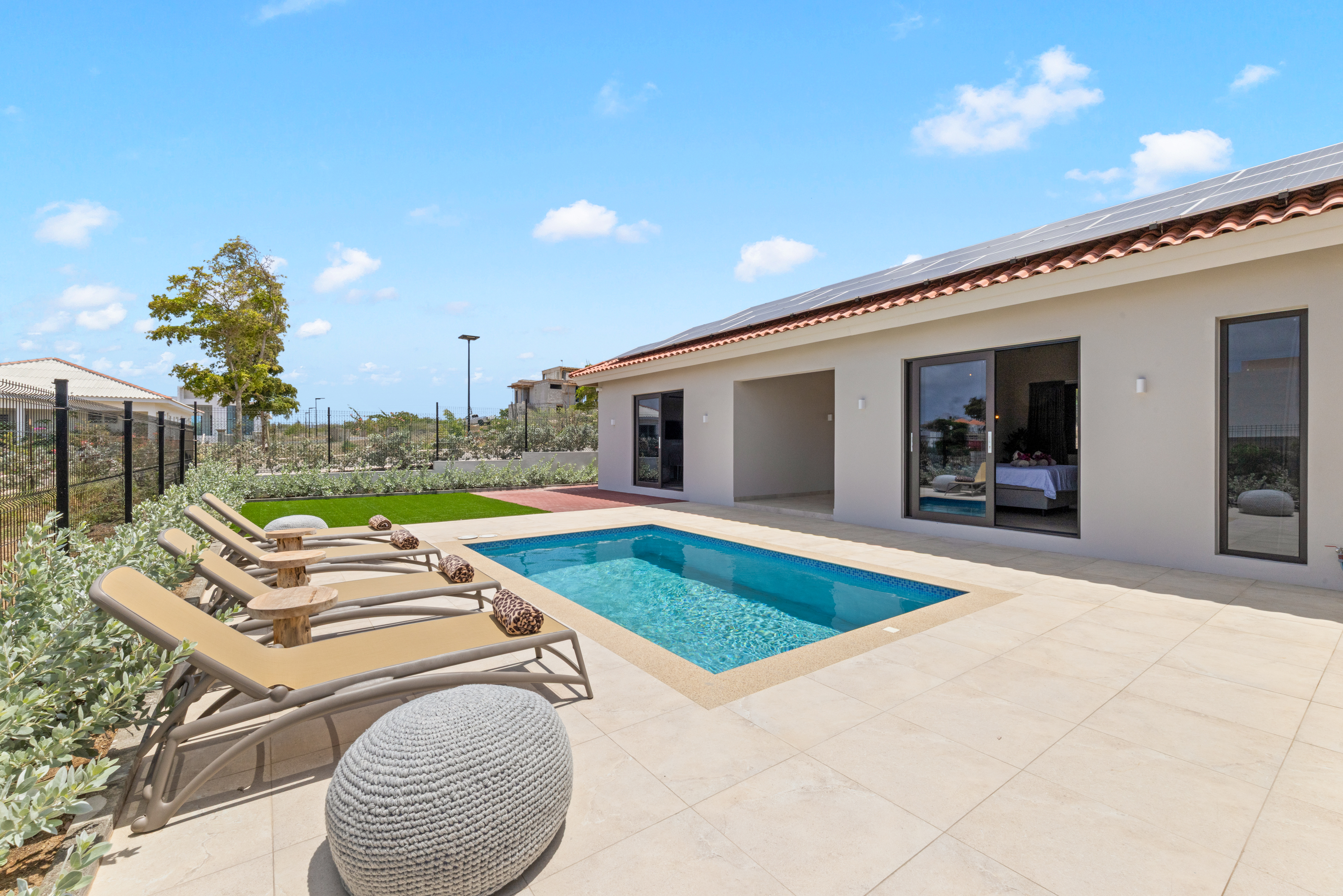 Pool with sun loungers
